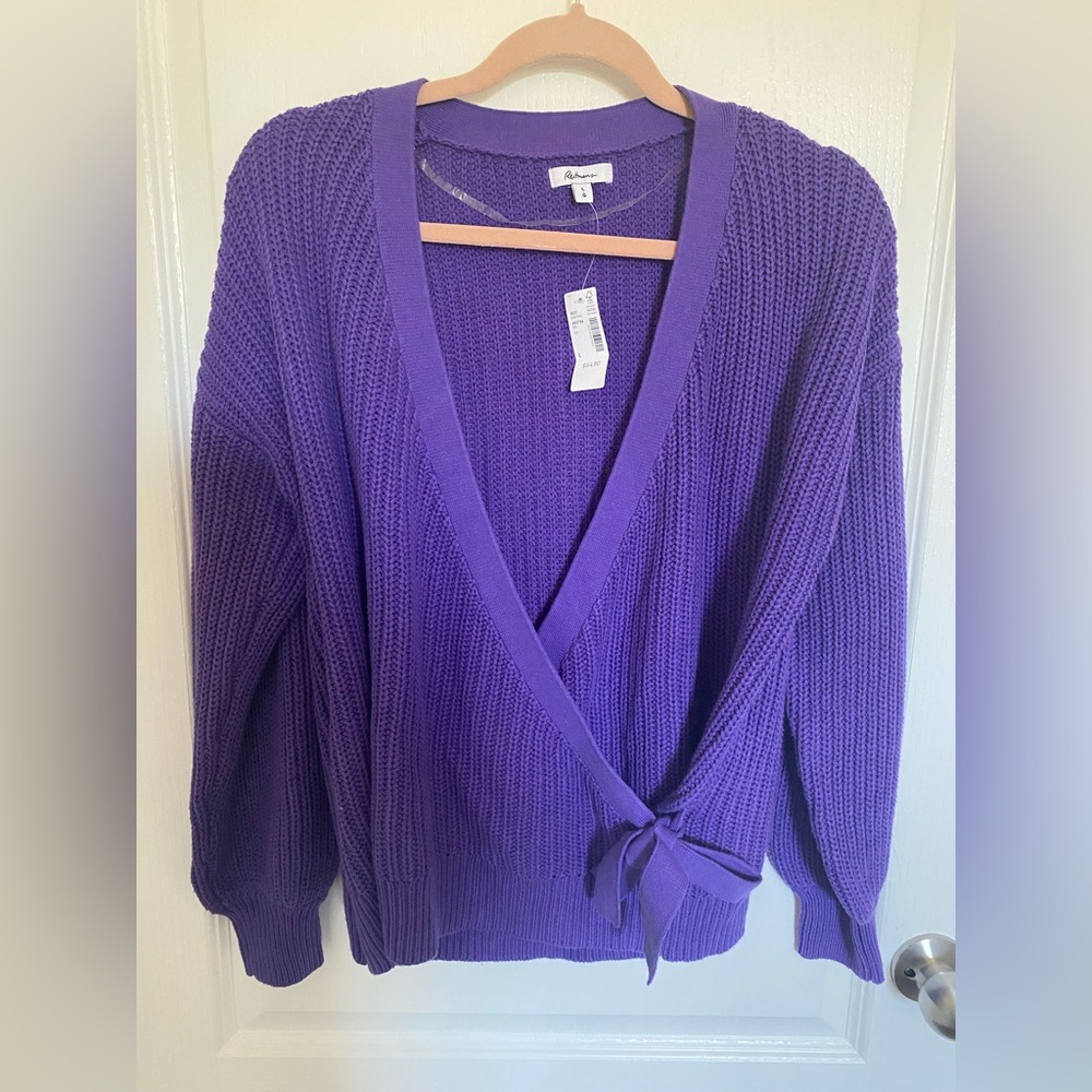 NWT- deep V-neck purple sweater with bow detail.